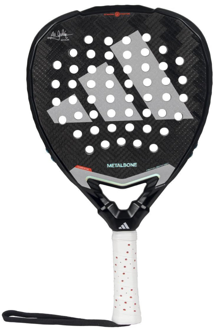 The adidas Metalbone 3.4 Padel Racket in black and white is ideal for advanced players, featuring a structured design with large white triangles, multiple perforations, and a textured grip. It includes a wrist strap at the handle's base for secure play.