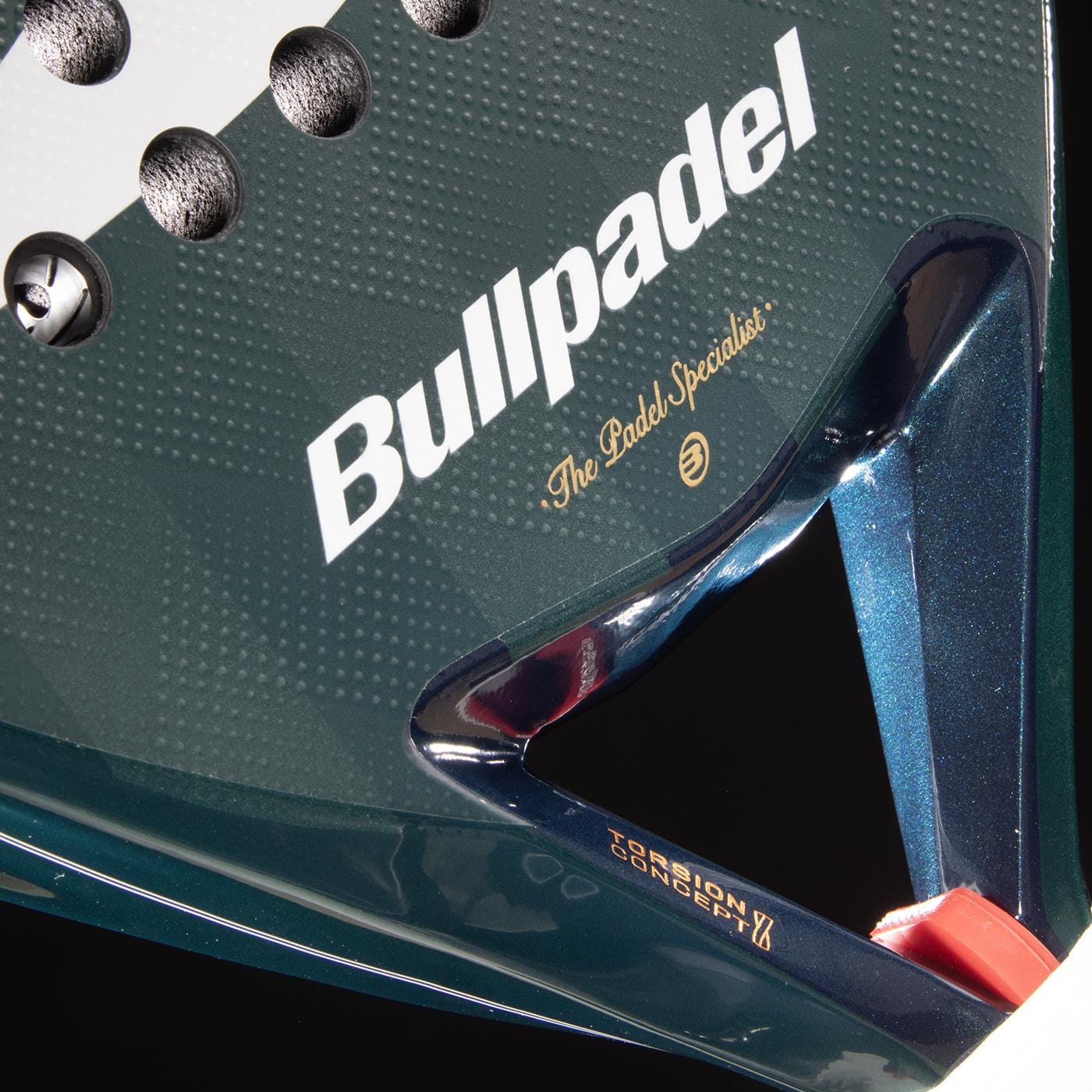 Close-up of the Bullpadel Icon 2026 Padel Racket - Green, featuring the Bullpadel logo, "The Padel Specialist" slogan, and a portion of its surface with a distinctive green frame and red detail.