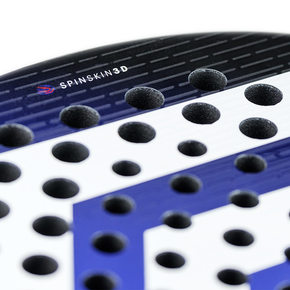 A close-up of the Tecnifibre Curva Soft Padel Racket in blue and white features "SpinSkin 3D" text. This model showcases a dotted texture, a geometric design, and X-SPEED technology for superior performance.