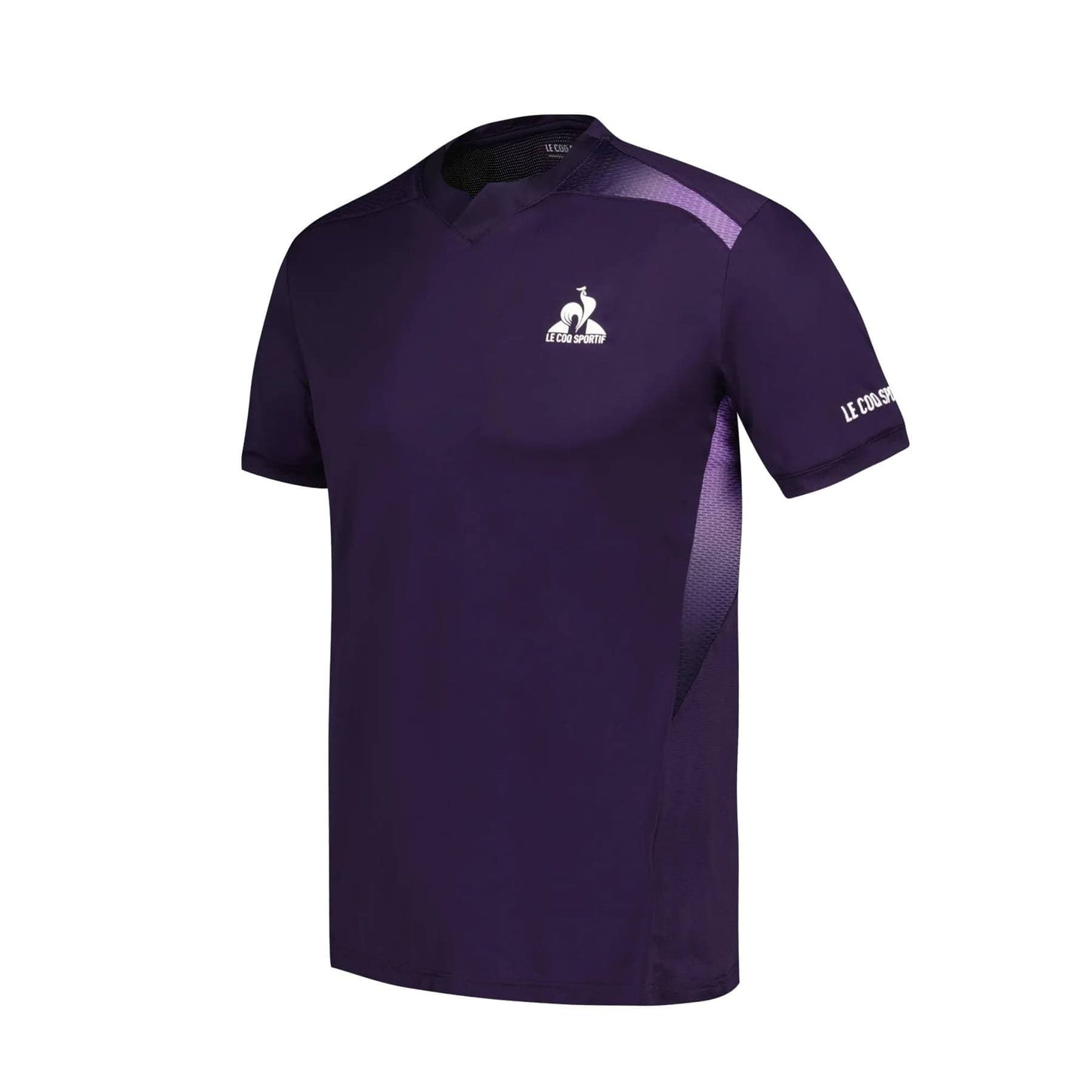 The Le Coq Sportif Pro Men's Padel T-Shirt in deep purple is a short-sleeve sports jersey engineered for comfort and freedom of movement. It features a small white rooster logo on the chest and the "Le Coq Sportif" brand name on the sleeve. This padel T-shirt is designed for breathability, accented with subtle lighter purple details on the shoulders.