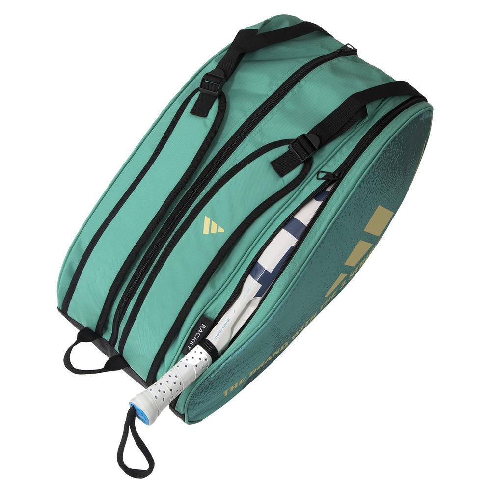 The ADIDAS Control 3.4 Padel Racket Bag in green, featuring a gold logo and text, includes multiple black zippered compartments. A tennis racket with a white handle is partially visible inside, enhancing your style on the court effortlessly.
