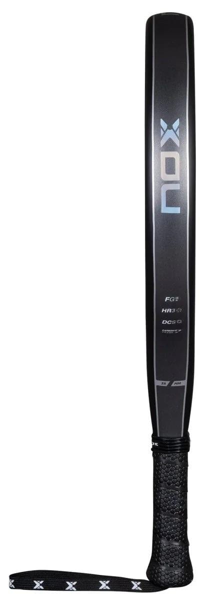 The NOX X-One Advance Series Padel Racket - Black features the NOX brand name displayed vertically, a textured grip, HR3 rubber core, and a black wrist strap with white X patterns.