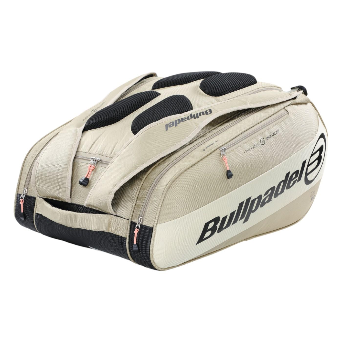 The Bullpadel Vertex 25 Padel Racket Bag in Stone has reinforced thermo-lined compartments, black accents with a logo, and durable handles. The zippers feature small red tags, making it ideal for carrying sports gear or a Vertex Padel Racket.