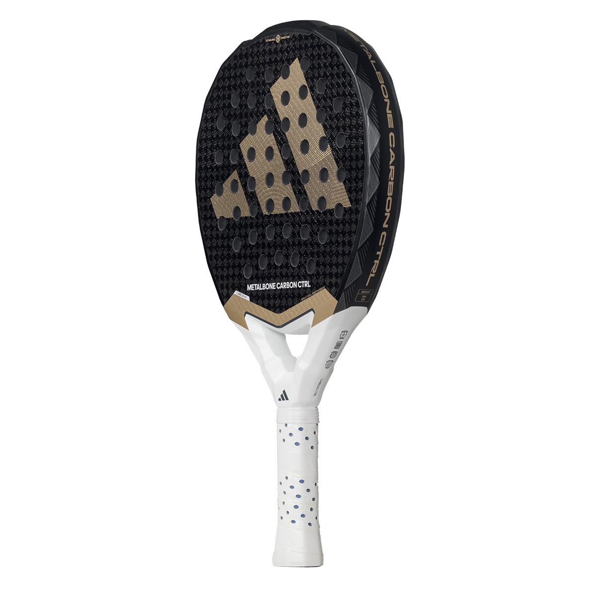 The image showcases the adidas Metalbone Carbon CTRL 3.4 padel racket in black and gold, perfect for advanced players. It features a white handle with a perforated grip, textured face, and prominent logo, blending style and performance seamlessly.