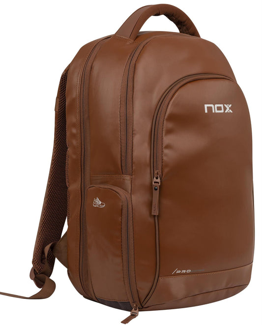 The NOX Pro Series Padel Backpack - Camel by NOX features multiple zippered compartments, a top handle, padded shoulder straps, and an air ventilation system—ideal for carrying sports or padel essentials comfortably.
