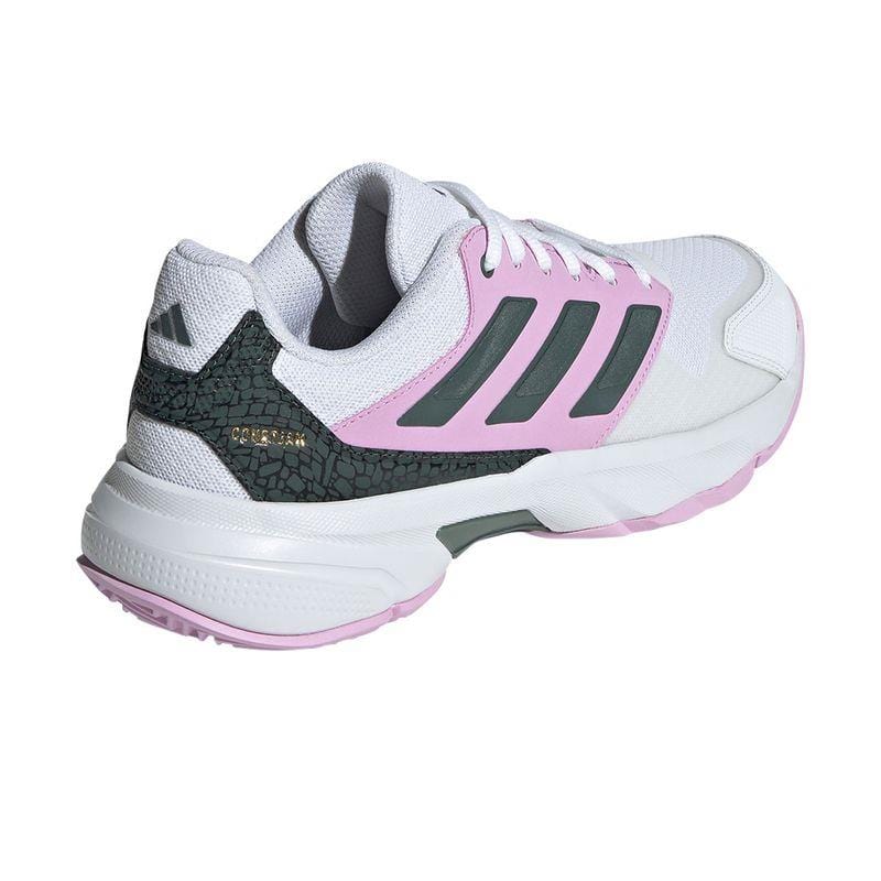 The ADIDAS CourtJam Control 3 Women's All Court Shoes in Bronze Strata, Legend Ink, and Bliss Lilac feature a chic design with distinctive accents. They showcase a textured pattern on the heel along with adidas' iconic three stripes. Equipped with a Bounce midsole for enhanced comfort, these shoes have a chunky sole and lace-up style, making them an ideal choice for the CourtJam Control 3 collection.