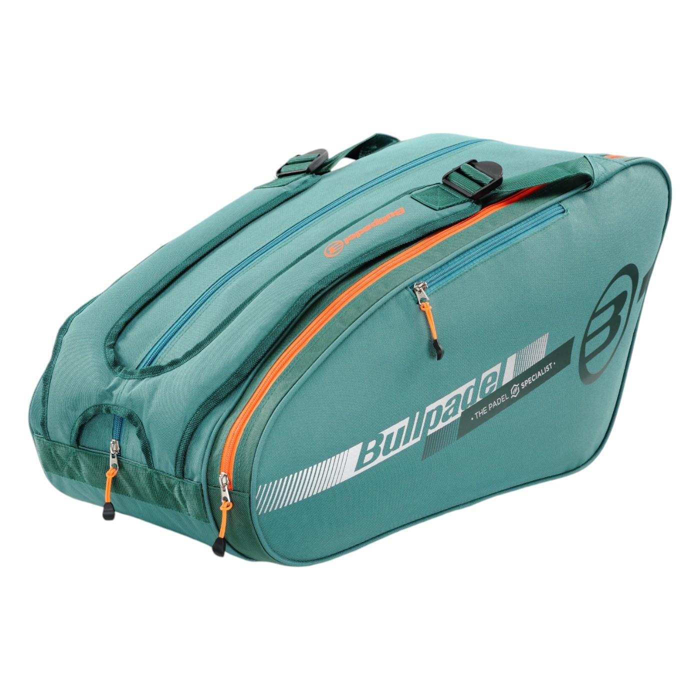 The Bullpadel Tour 25 Padel Racket Bag in teal is lightweight and spacious, featuring white "Bullpadel" branding and orange zipper pulls. It offers multiple zippered compartments, a padded racket section, and adjustable straps for convenience.