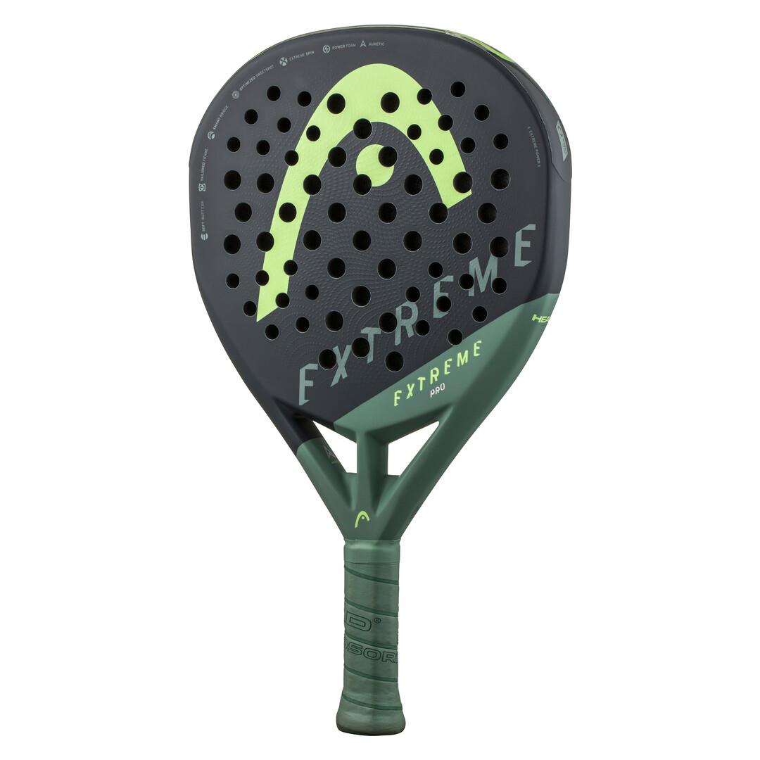 The HEAD Extreme Pro 2023 Padel Racket features a blend of dark gray and green with "Extreme" and "FXTreme" on its face. It includes circular holes, curved patterns, Extreme Spin technology, and a green grip for superior comfort.