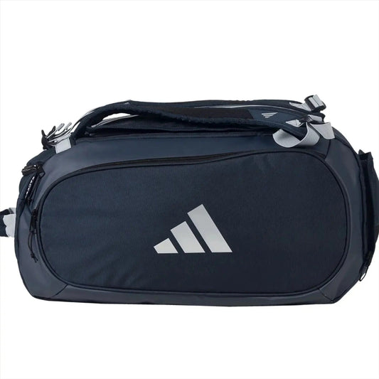 The ADIDAS Tour 3.4 Padel Racket Bag by adidas is a blue sports bag with multiple zippers and a top handle, ideal for padel rackets or equipment, and is shown against a plain white background.
