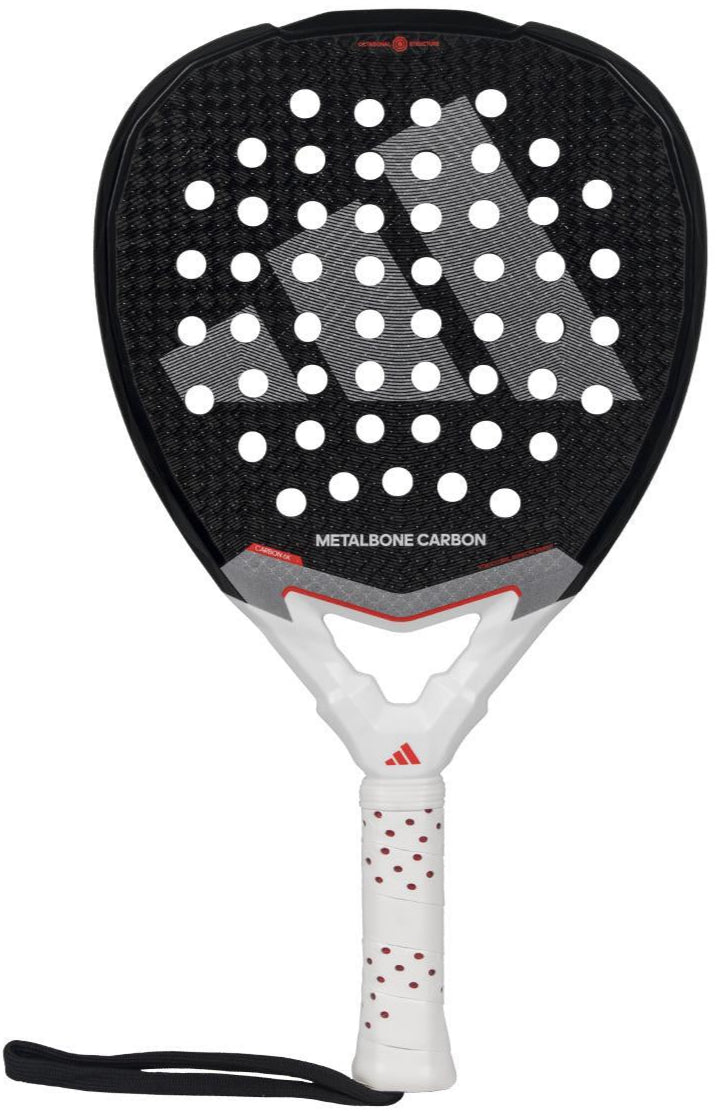 The adidas Metalbone Carbon 3.4 Padel Racket, in black and white, features a perforated surface with red accents, ideal for advanced players. It includes a white handle with red dots, black wrist strap, and "METALBONE CARBON" branding on display.