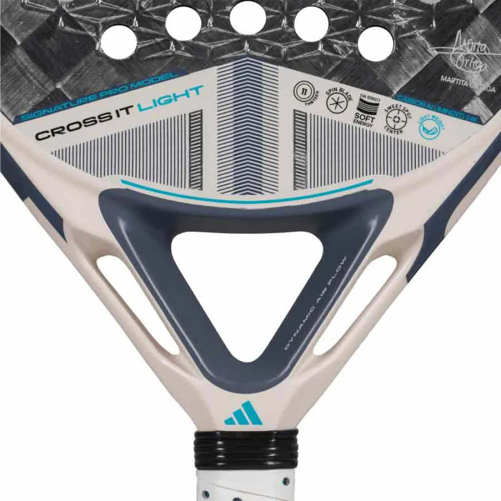 Close-up of the adidas Cross It Light 3.4 Padel Racket - Chalk White featuring "CROSS IT LIGHT" labeling, bold blue, grey, and white geometric designs, plus icons showing Dynamic Air Flow and Power Extra Grip features on top.