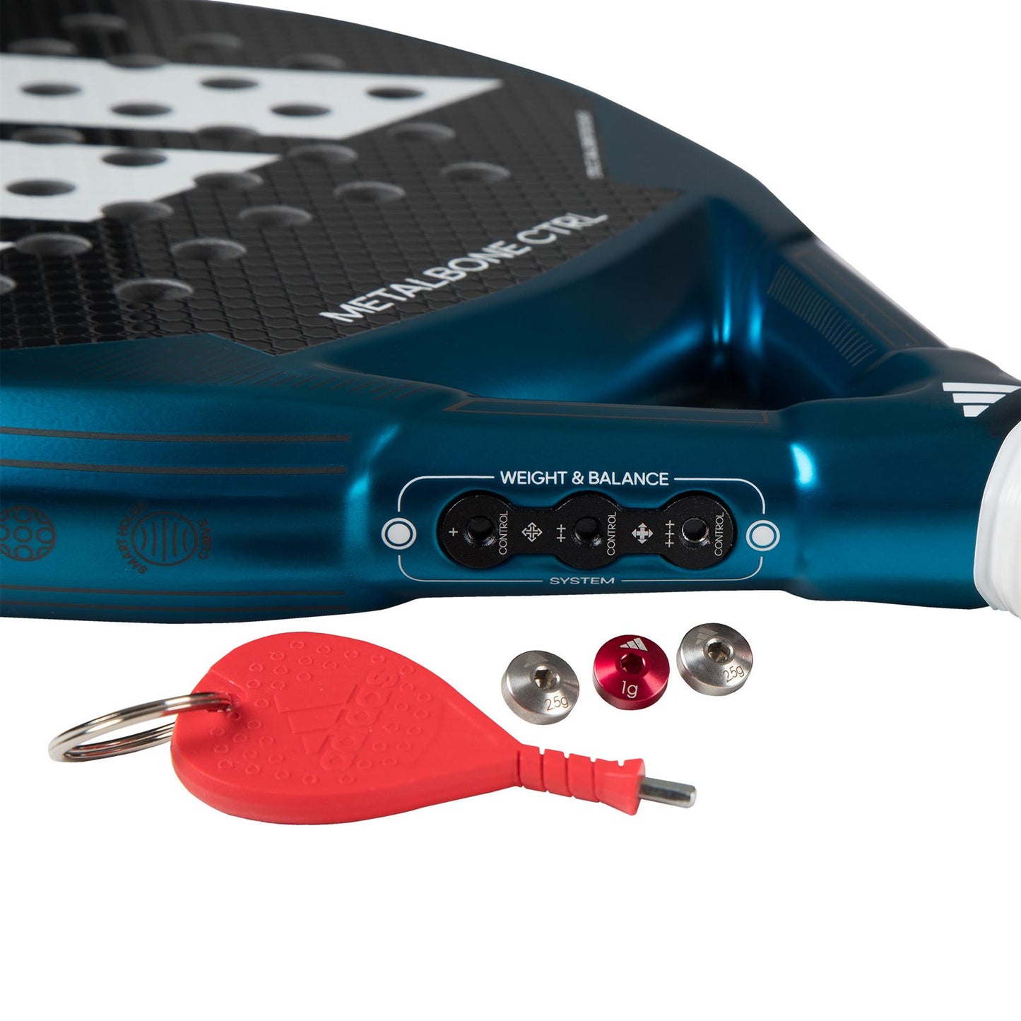 A close-up of the ADIDAS Metalbone CTRL 3.3 Padel Racket in blue showcases its weight and balance adjustment system, designed specifically for advanced players. It includes three small metal weights and a red tool with a keyring, offering customizable settings to enhance performance.