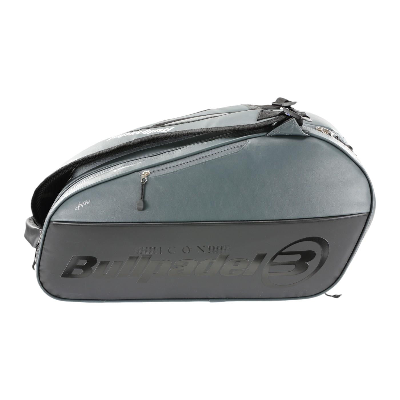 The Bullpadel Icon 25 Padel Racket Bag, in a sleek graffiti design, prominently features the "Bullpadel" name on the side. With a zippered compartment, it's perfect for easily carrying sports equipment like Juan Martín Díaz’s gear.