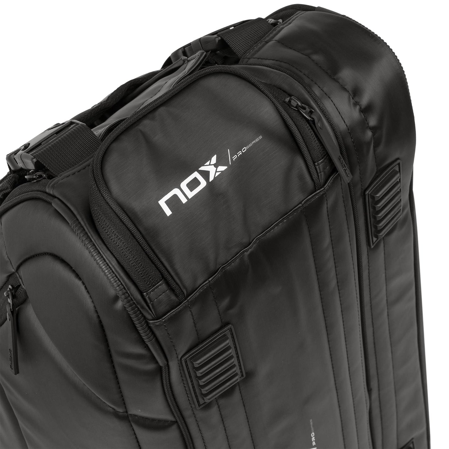 Close-up of the NOX Pro Series Padel Racket Bag in black, featuring a shiny finish, multiple zippered compartments, ThermoTech protection, ergonomic main handle, and "nox" and "pro series" logos in white on the front.