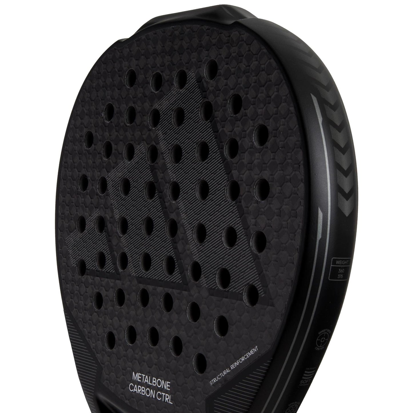 Close-up of an adidas ADIDAS Metalbone Carbon CTRL 3.3 Padel Racket in black, featuring textured surface with circular holes and "METALBONE CARBON CTRL" and "SPIN BLADE." The sleek design highlights the Spin Blade decal on its durable 6K carbon structure.