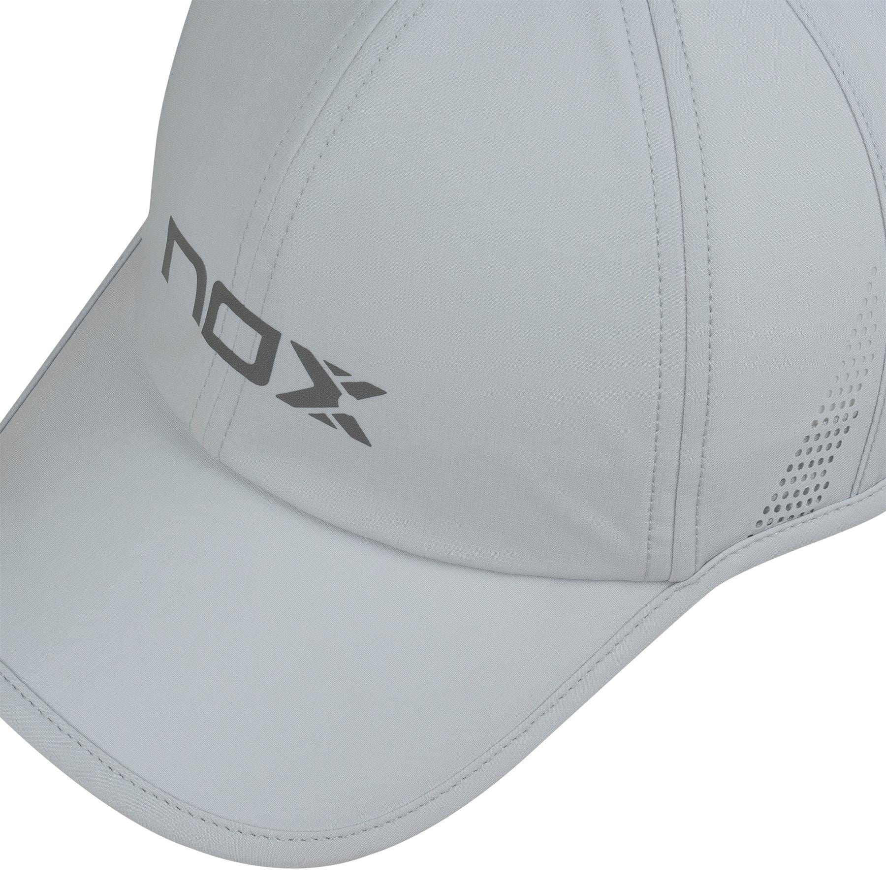 A close-up of the NOX Padel Cap - Grey by NOX, featuring stitched panels, side ventilation holes, and an adjustable velcro strap. "nox" and an "X" logo are printed in gray on the front panel for comfort and sun protection.
