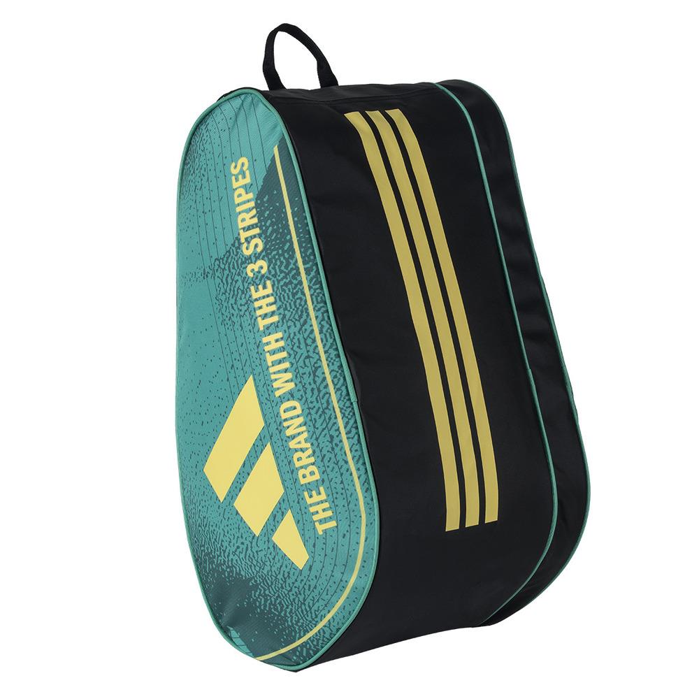 The ADIDAS Control 3.4 Padel Racket Bag, in teal and black with gold diagonal stripes, is perfect for court accessories. It features "THE BRAND WITH THE 3 STRIPES" in gold on the teal area and includes a black top handle for easy carrying.