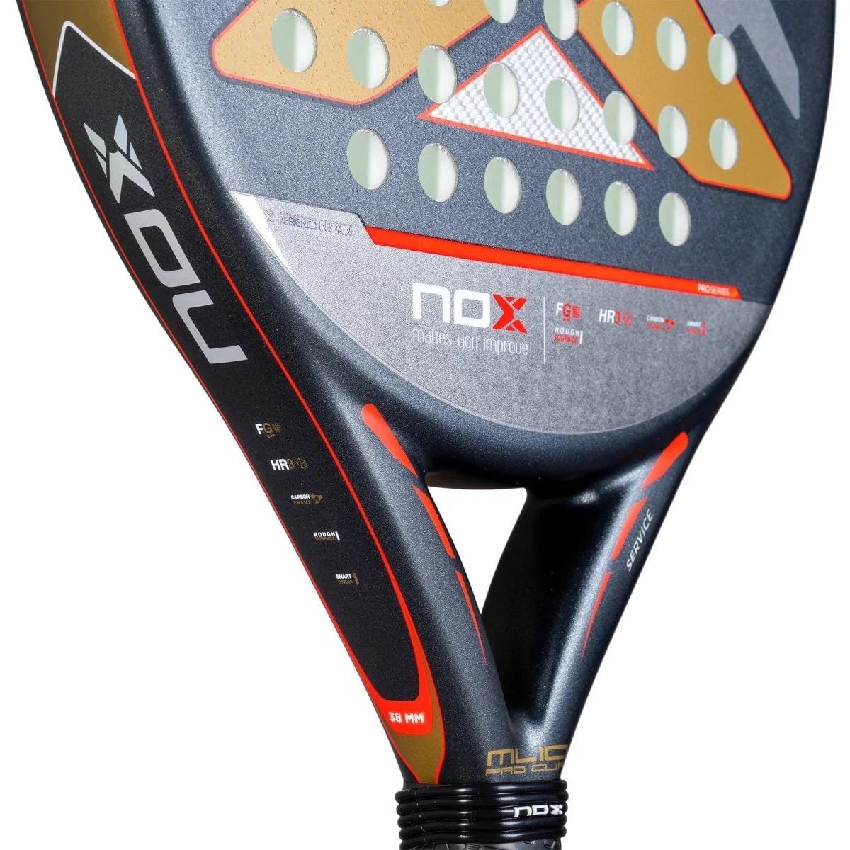 Close-up of the NOX ML10 Pro Cup Rough Surface By Miguel Lamperti 2025 padel racket, showing its black and red design with white and orange accents, circular holes, rough hitting surface, NOX logo, and Smartstrap® System on the frame.