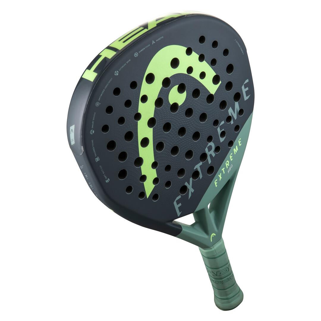 The HEAD Extreme Pro 2023 Padel Racket - Green features a sleek black and green design with the brand name prominently displayed. It offers Extreme Spin technology, a perforated surface, and a comfortable green grip handle for enhanced court performance.