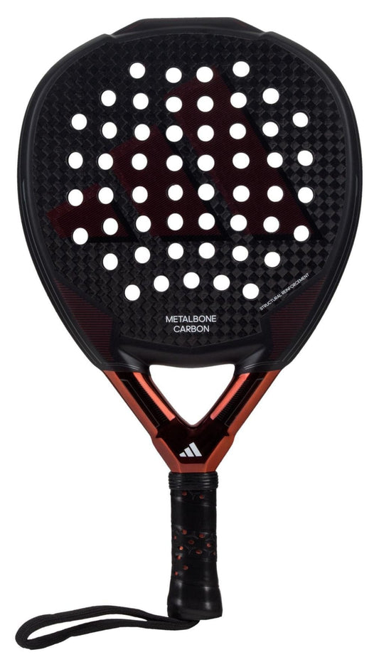 Introducing the stylish ADIDAS Metalbone Carbon 3.3 padel racket in black and copper, featuring a perforated surface for improved aerodynamics. The handle provides a secure grip with its wrist strap, while the design boasts a dot pattern and durable 6K carbon fiber texture for optimal performance.