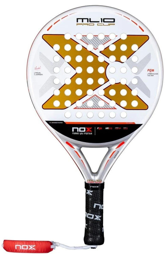 The NOX ML10 Pro Cup Coorp By Miguel Lamperti 2025 padel racket features a gold and white "X" design, round head with perforated holes, black Nox-logo grip, red wrist strap, and the innovative Smartstrap system.