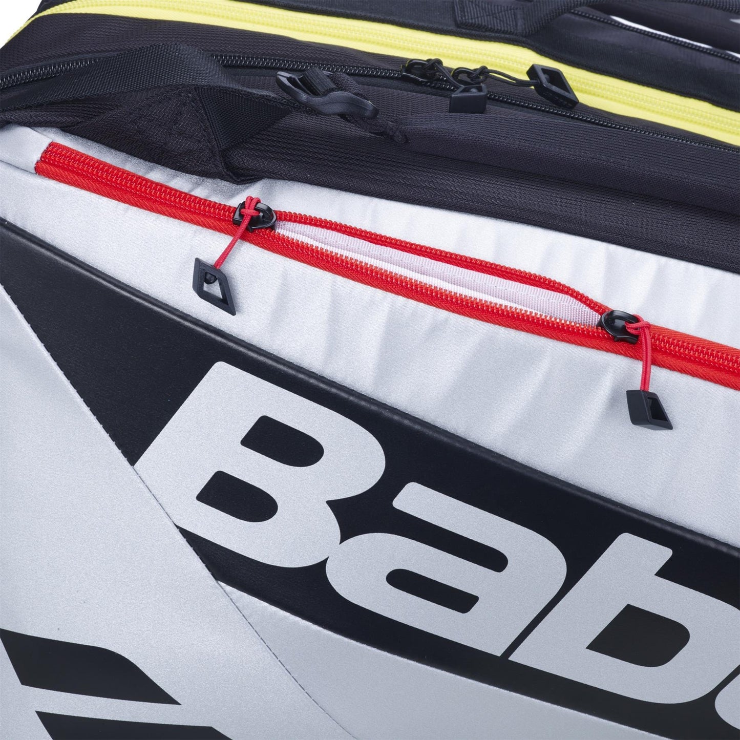 Close-up of the Babolat RH Pro 4 Racket Padel Bag in black and silver, featuring bold branding, a red zipper with black pull tabs, and an insulated compartment to protect your rackets.