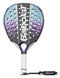 The Babolat Dyna Spirit Padel Racket in black and purple features a striking teardrop headshape with enhanced 3D Spin capabilities. It includes a white grip and black wrist strap, while the brand name "Babolat" is prominently displayed across the center of the racket face, which showcases a geometric design with perforations.