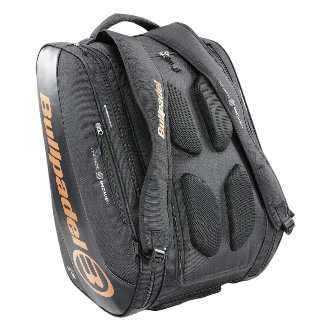 The Bullpadel Vertex 25 Padel Racket Bag in black features padded shoulder straps, multiple zippered compartments, and a ventilated section for sports gear, with orange Bullpadel branding on the side to match your Vertex Padel Racket.