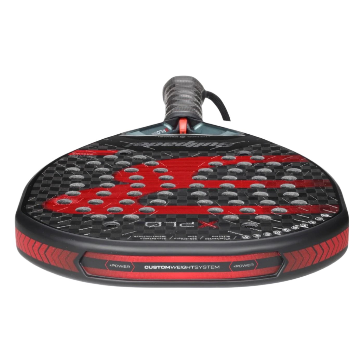 A close-up of the Bullpadel Xplo 2025 Padel Racket - Black / Red showcases its striking honeycomb-patterned face and "Custom Weight System" text along the edge. The textured grip on the handle enhances its sleek, sporty look, making this Bullpadel creation a formidable choice for delivering explosive power.