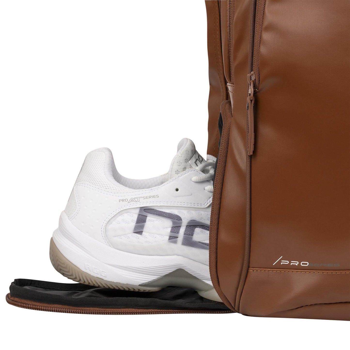 A white athletic shoe peeks from the shoe compartment of the NOX Pro Series Padel Backpack - Camel, highlighting its organized storage—ideal for carrying your padel essentials by NOX.