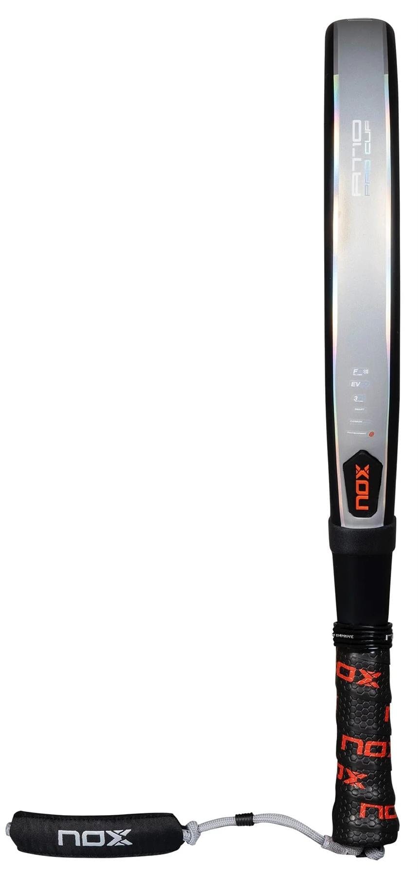 The NOX AT10 Pro Cup HARD By Agustin Tapia 2025 padel racket features a striking black and silver design with red accents, a black handle with branded grip tape, and a Smartstrap® wrist strap displaying the NOX logo.