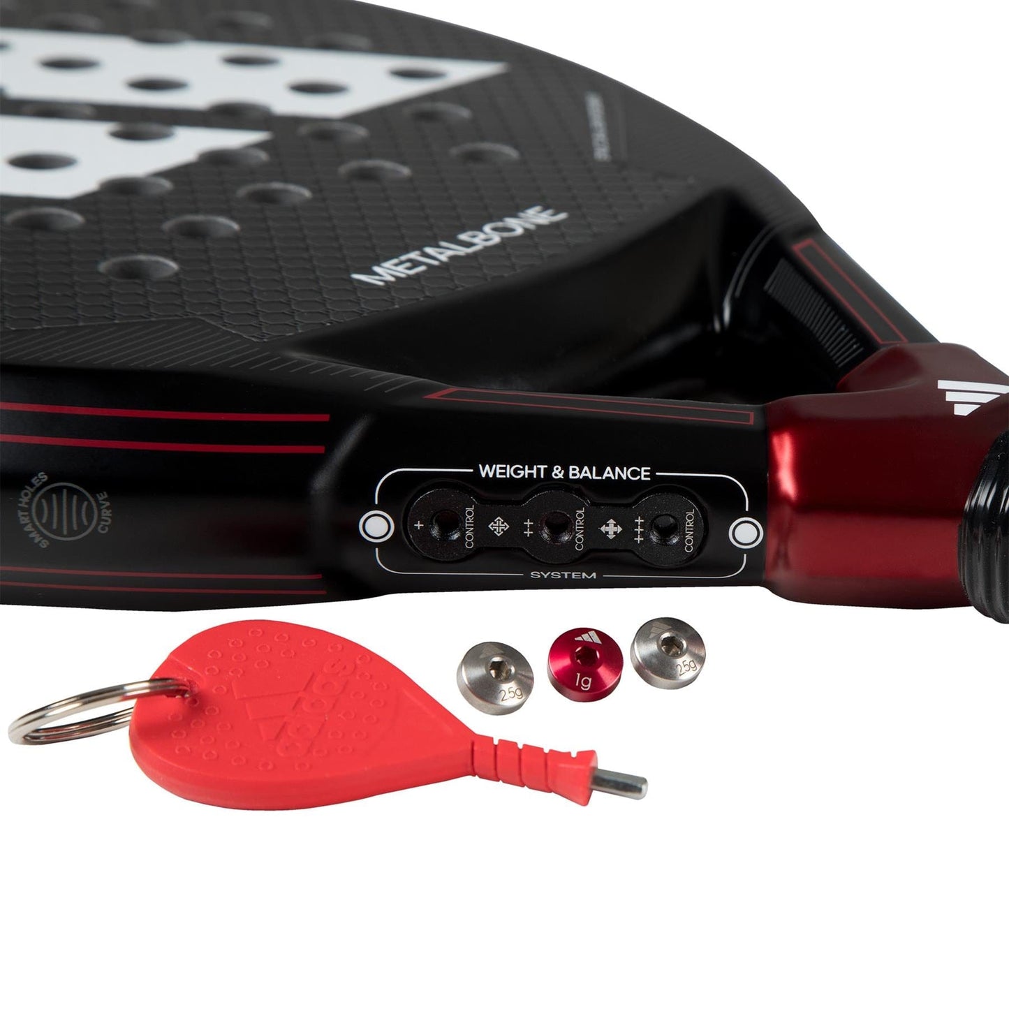 A close-up of the adidas ADIDAS Metalbone 3.3 Padel Racket in a striking black and red design. This racket is ideal for advanced players, featuring an adjustable weight and balance system, a red adjustment key, and three metal weights for power customization adorned with "Metalbone" branding.