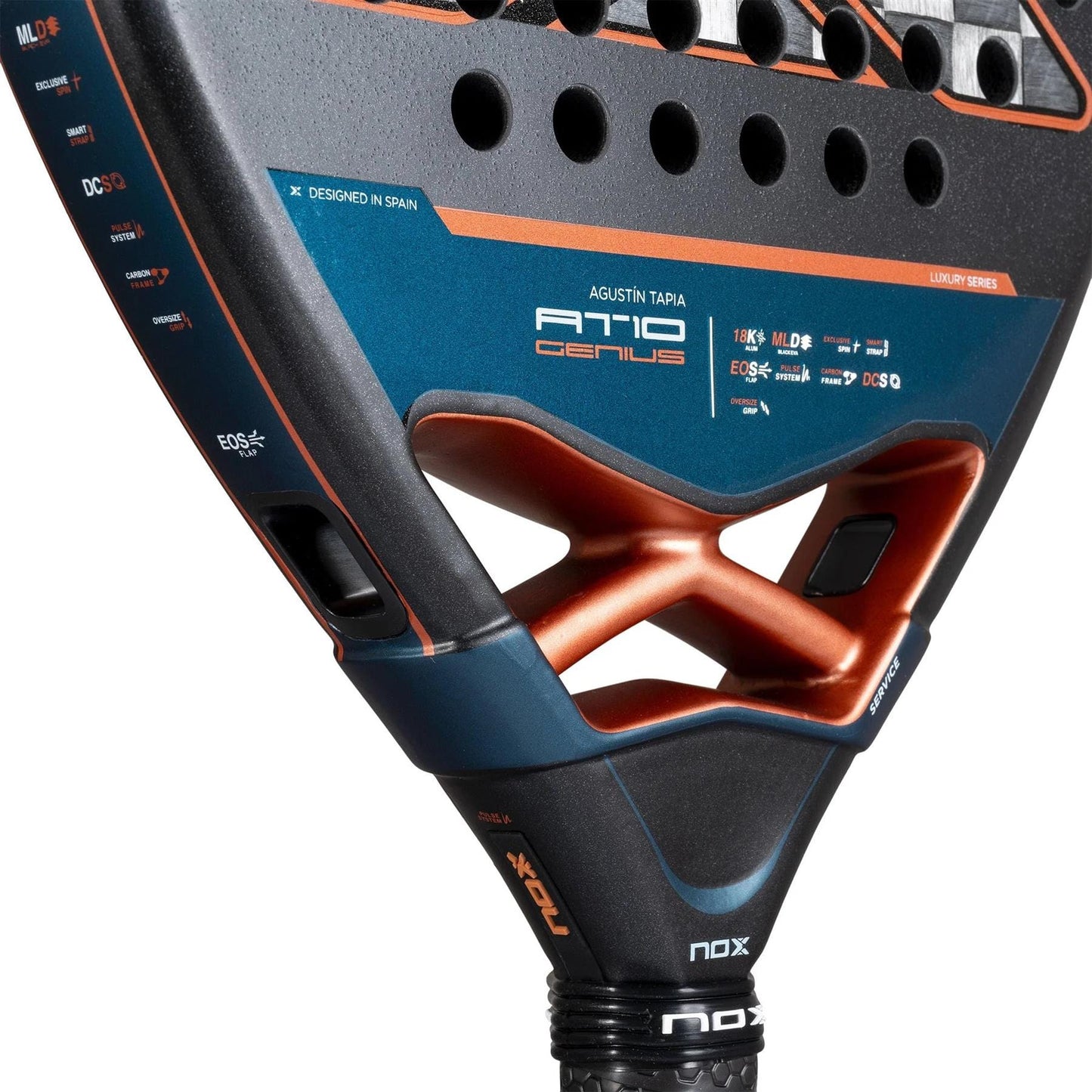 Close-up of the NOX AT10 Luxury Genius Attack 18K Alum By Agustin Tapia 2025 padel racket, featuring its orange and blue frame, technical details, model name, and Agustin Tapia’s signature on the head.