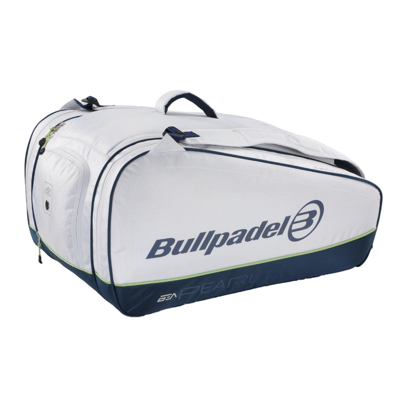 The Bullpadel Pearl 25 Padel Racket Bag in white, favored by Bea González, has a logo on the side, large size, multiple zippered compartments, carrying handles, and dark blue trim on the bottom edges.
