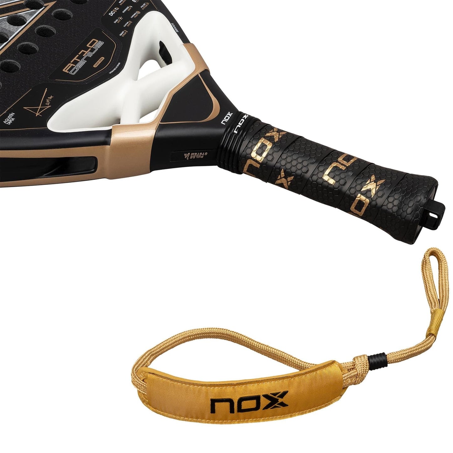 Close-up of the NOX AT10 Genius 18K Alum By Agustín Tapia 2026 Padel Racket handle, wrapped with "NOX" grip tape, showing the Weight Balance system and a gold wrist strap with the NOX logo.