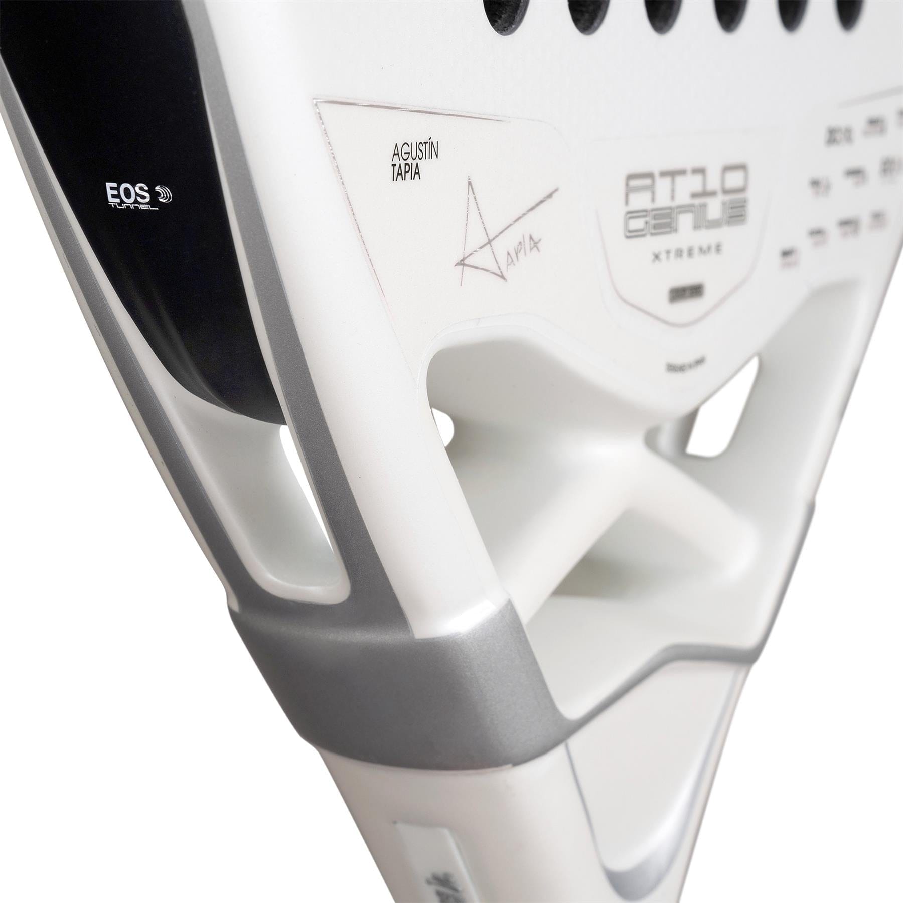 Close-up of the NOX AT10 Genius Attack 12K Alum Extrem By Agustín Tapia 2026 padel racket, featuring Agustín Tapia's signature and a sleek black, silver, and white design—engineered by NOX for powerful court play.