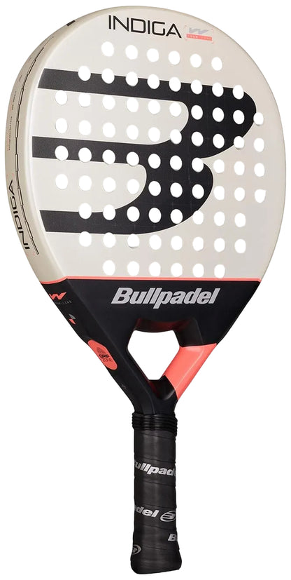 The Bullpadel Indiga W 2026 Padel Racket by Bullpadel features a white and black face with a bold "B" logo, multiple round holes, red accents, a black handle, and offers lightweight performance for agile gameplay.