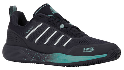 The K-Swiss Ultra Court Men’s Padel Shoe in Carbon, Baltic, and Glacier Gray is displayed angled to the right against a white background, showcasing its stylish black design with white stripes, teal accents, and a textured sole—an ideal lightweight court shoe from K-Swiss built for dynamic performance.