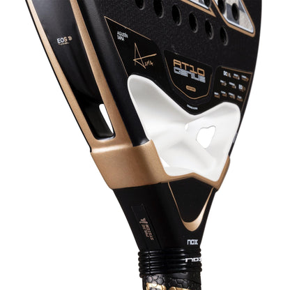 Close-up of the NOX AT10 Genius 18K Alum By Agustín Tapia 2026 Padel Racket in black and gold, featuring technical details, "Alpha," NOX branding, Dual Spin surface, highlighted Weight Balance system, and textured grip for ultimate control.