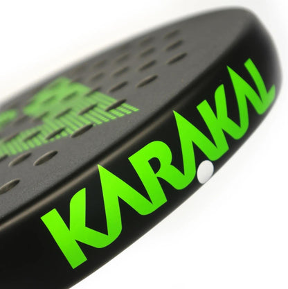 Close-up of the Karakal Air Lite 345 Green Padel Racket, showing bold green "KARAKAL" branding and visible perforations on the black edge of this lightweight padel racket.