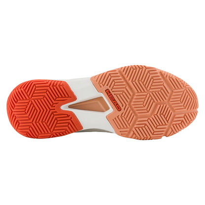 The image displays the sole of the HEAD Motion Team Women's Padel Shoes in White/Coral, featuring a geometric tread for multi-directional grip. The vibrant orange and muted peach hues complement the "HEAD" logo, ensuring stability and comfort with every step.