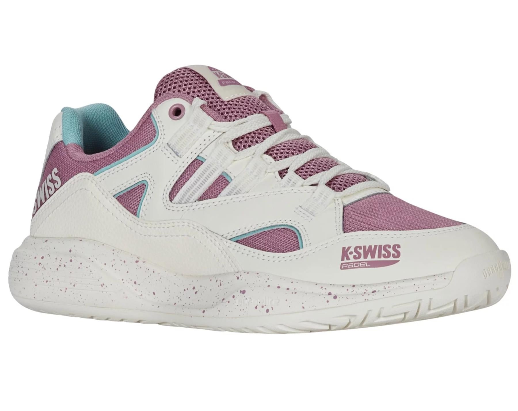 The K-Swiss Tura Team Women's Padel Shoes feature a white and pink design with purple mesh accents, turquoise lining, and pink speckled midsoles for enhanced cushioning. Branded "K-Swiss" with "Paddle," they offer excellent court grip for sports or casual wear.