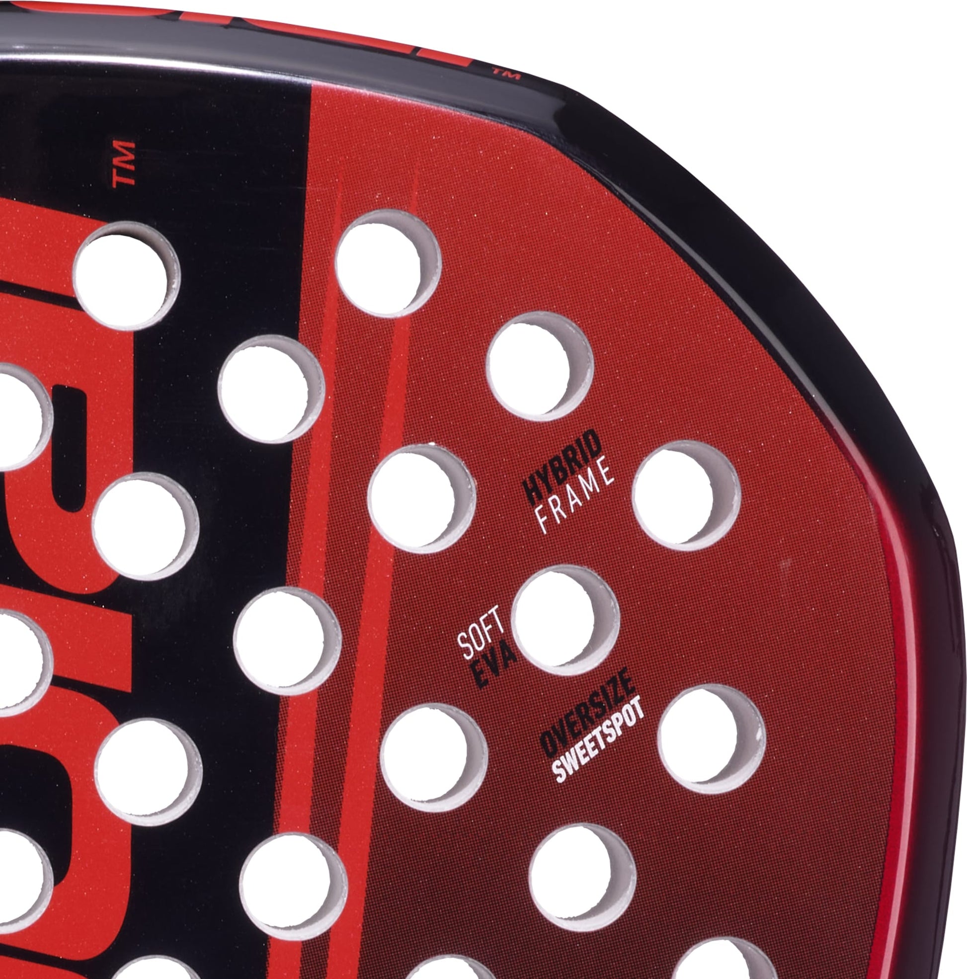 Close-up of the Babolat Technical Origin + 2026 Padel Racket in red and black, highlighting drilled holes and surface text labels including "HYBRID FRAME," "SOFT EVA," and "OVERSIZE SWEETSPOT." This Babolat padel racket is crafted with advanced fibreglass construction for superior performance.
