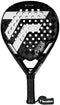 A black and white Tecnifibre Curva Power 2026 Padel Racket from Tecnifibre, featuring a textured 18K carbon surface, precision-drilled perforated holes, a black grip, and an attached wrist strap with the Tecnifibre logo.