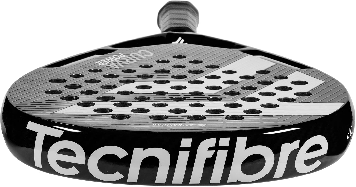 Featuring a close-up of the Tecnifibre Curva Power 2026 Padel Racket in black, this racket displays a textured surface with multiple round holes and is equipped with a gray grip handle. The brand name “Tecnifibre” is prominently printed in large white letters on the frame, emphasizing its signature power-focused design.