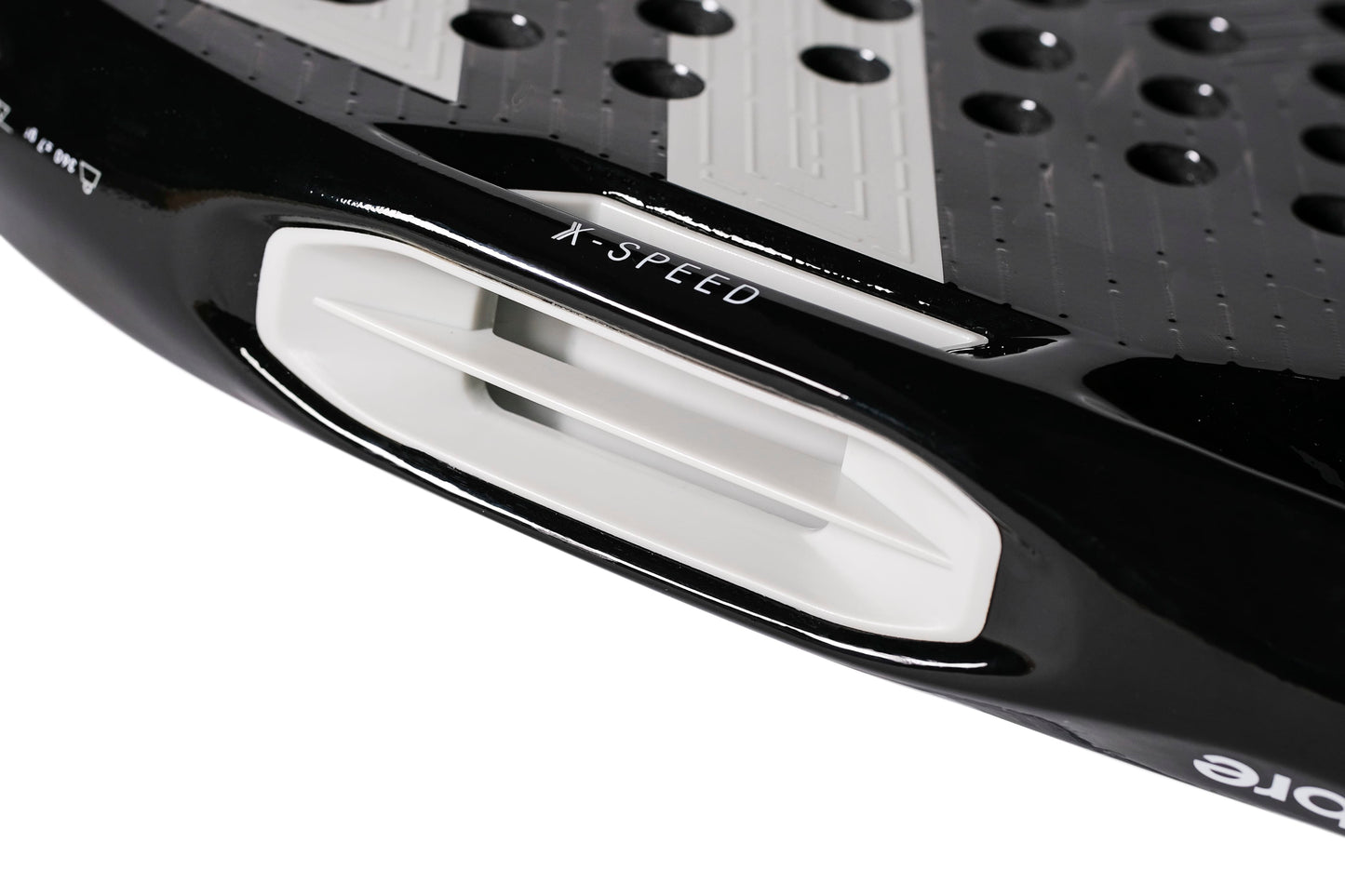 Close-up of the Tecnifibre Curva Power 2026 Padel Racket by Tecnifibre in black, highlighting a white ventilation slot marked “X-SPEED,” a textured 18K carbon surface with circular holes, and a glossy finish.