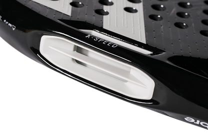 Close-up of the Tecnifibre Curva Power 2026 Padel Racket by Tecnifibre in black, highlighting a white ventilation slot marked “X-SPEED,” a textured 18K carbon surface with circular holes, and a glossy finish.