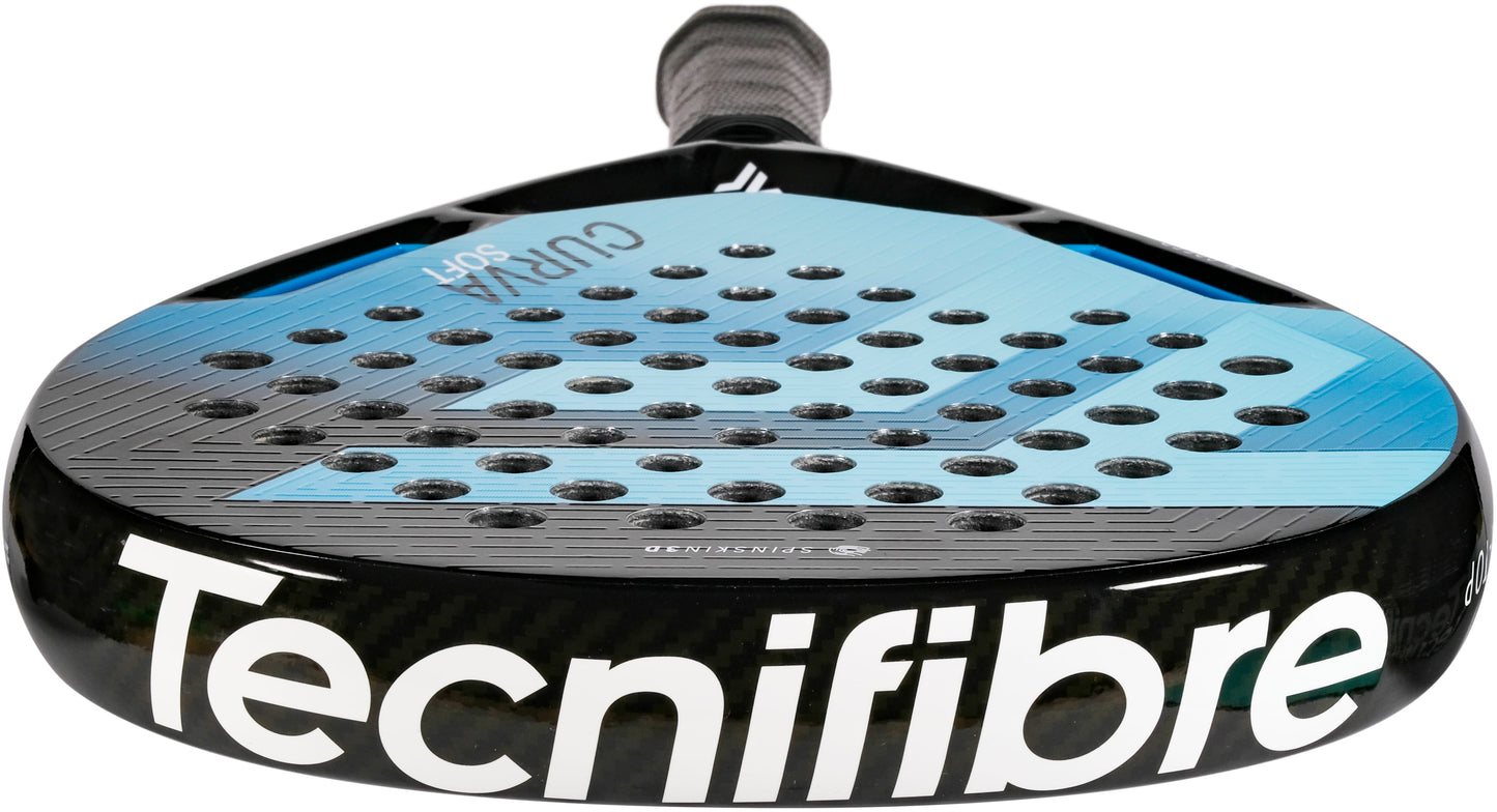 A detailed view of the Tecnifibre Curva Soft 2026 Padel Racket by Tecnifibre showcases its black and blue color scheme, teardrop-shaped head, numerous circular perforations on the striking surface, and a textured handle.