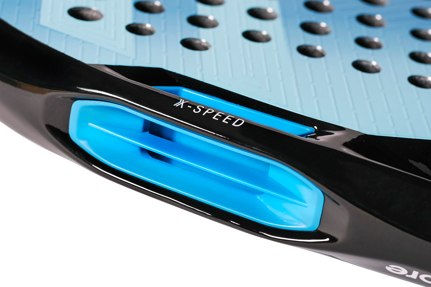 Close-up of the Tecnifibre Curva Soft 2026 Padel Racket, showing its blue and black design with a vent marked “X-SPEED” and raised black dots on the textured blue surface; a detail from this teardrop-shaped racket by Tecnifibre.