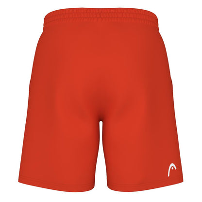 The image displays the back view of a pair of HEAD Vision Power Men's Padel Shorts in Orange Alert, featuring an elastic waistband. A small white HEAD logo is located on the lower left side of the shorts, which are made with 4-way stretch fabric for improved flexibility.